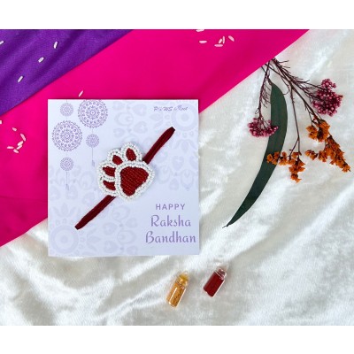 Red and white beaded paw Rakhi
