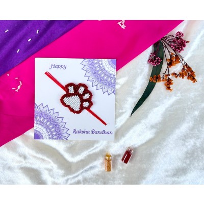 White and red beaded paw Rakhi